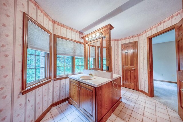 23 Pintail Dr, Indiana Twp Nal, PA 15238 - bathroom with wallpapered walls, vanity, baseboards, tile patterned floors, and a textured ceiling