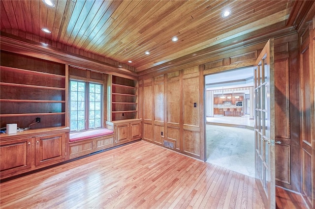 23 Pintail Dr, Indiana Twp Nal, PA 15238 - empty room with light wood-type flooring, wood walls, wood ceiling, recessed lighting, and built in shelves