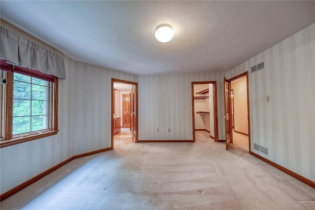 23 Pintail Dr, Indiana Twp Nal, PA 15238 - empty room featuring light colored carpet, wallpapered walls, baseboards, and a textured ceiling