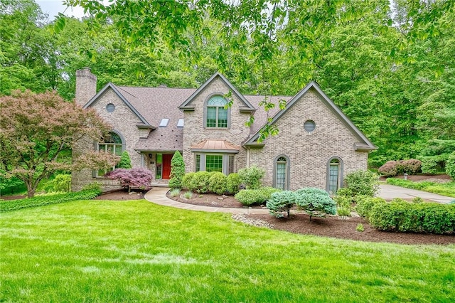 23 Pintail Dr, Indiana Twp Nal, PA 15238 - view of front of house with a front yard, a chimney, and brick siding