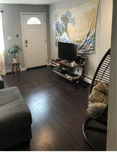 1322 Lowrie St, Troy Hill, PA 15212 - living room with wood finished floors and baseboards