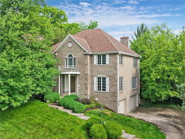 15 Rosemont Ln, Squirrel Hill, PA 15217 - colonial inspired home with a balcony, driveway, a chimney, an attached garage, and a front yard