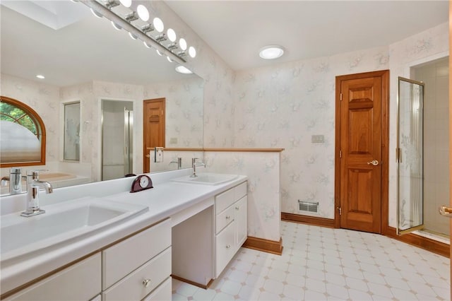 15 Rosemont Ln, Squirrel Hill, PA 15217 - bathroom with tile patterned floors, double vanity, a shower stall, baseboards, and wallpapered walls