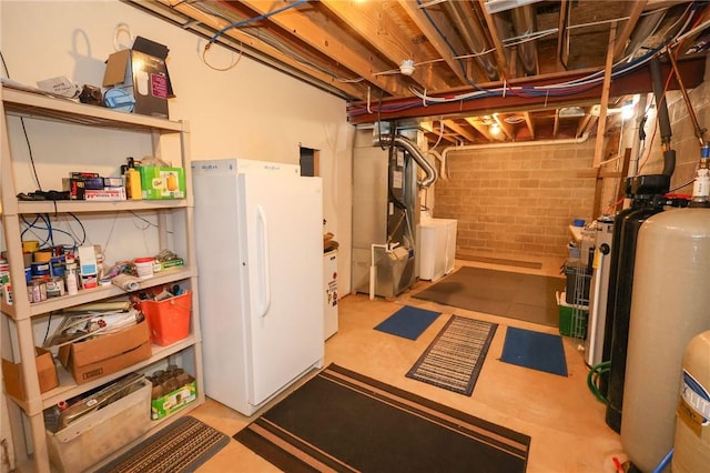 1147 Annisville Rd, Washington Twp But, PA 16050 - unfinished basement featuring freestanding refrigerator, heating unit, and a water softener system