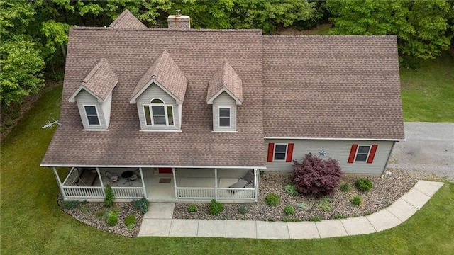 1147 Annisville Rd, Washington Twp But, PA 16050 - view of front of house with roof with shingles, a front yard, a chimney, and a porch