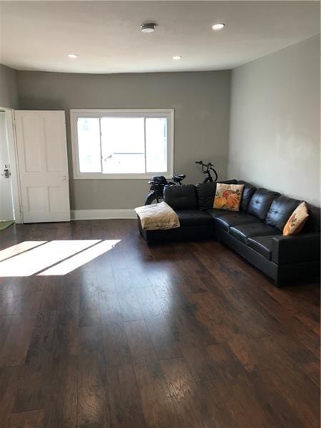 1124 Brabec St, Troy Hill, PA 15212 - living area with wood finished floors, recessed lighting, and baseboards