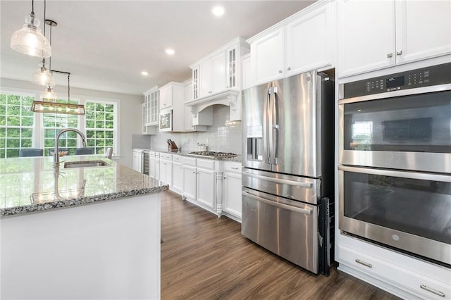 712 Mulkerrin Ct, Pine Twp Nal, PA 16046 - kitchen with appliances with stainless steel finishes, a sink, white cabinetry, dark wood-style flooring, and wine cooler