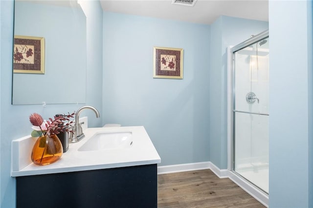 712 Mulkerrin Ct, Pine Twp Nal, PA 16046 - bathroom with vanity, a stall shower, wood finished floors, and baseboards
