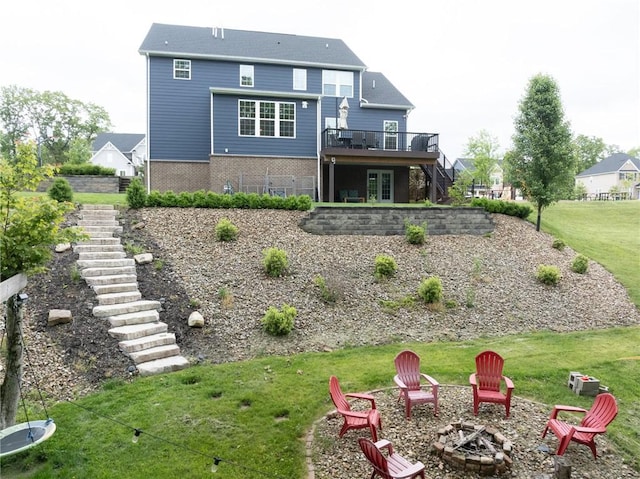 712 Mulkerrin Ct, Pine Twp Nal, PA 16046 - back of house featuring an outdoor fire pit, stairs, a wooden deck, a yard, and brick siding