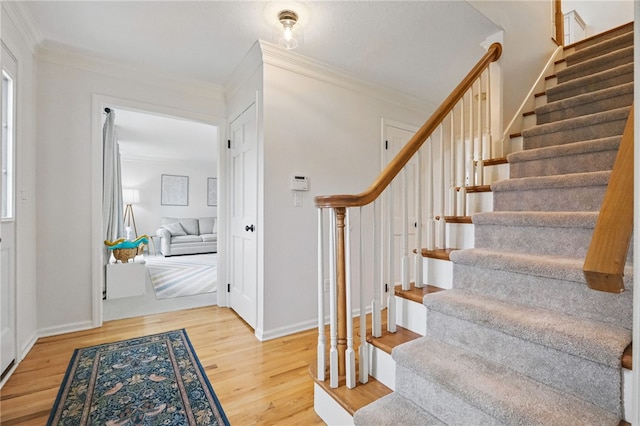 2455 Wedgewood Dr, Franklin Park, PA 15090 - entryway with stairs, ornamental molding, wood finished floors, and baseboards