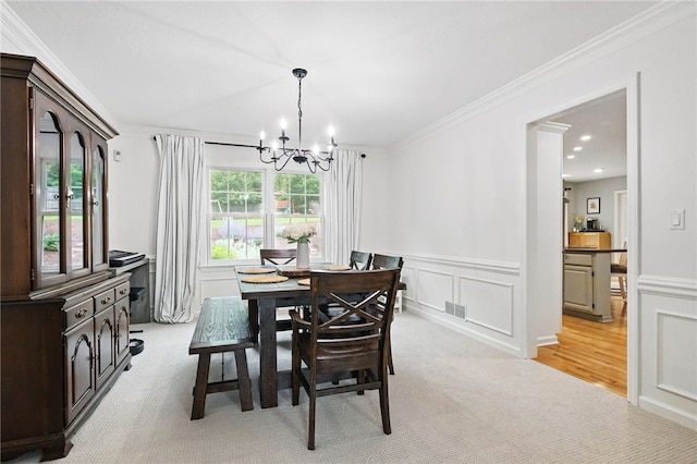 2455 Wedgewood Dr, Franklin Park, PA 15090 - dining room with a chandelier, light colored carpet, ornamental molding, a decorative wall, and a wainscoted wall