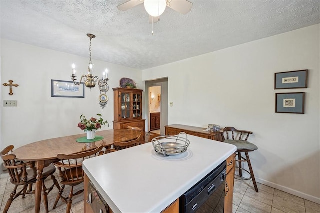 73 Hartman Rd, Green/Commdre/Prchse, PA 15759 - kitchen with black dishwasher, baseboards, a textured ceiling, light countertops, and a kitchen island