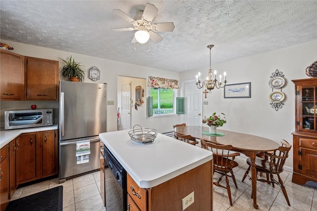 73 Hartman Rd, Green/Commdre/Prchse, PA 15759 - kitchen with appliances with stainless steel finishes, light countertops, brown cabinetry, light tile patterned flooring, and ceiling fan
