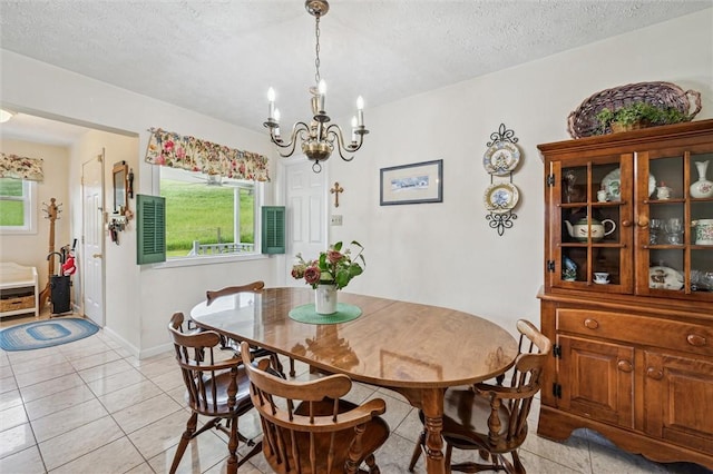 73 Hartman Rd, Green/Commdre/Prchse, PA 15759 - dining area featuring a chandelier, light tile patterned flooring, and a textured ceiling