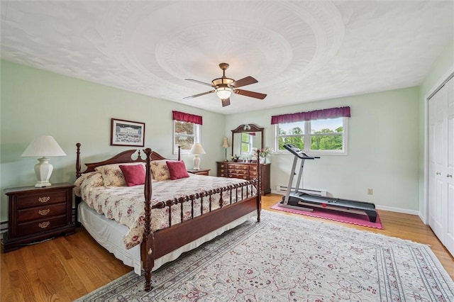 73 Hartman Rd, Green/Commdre/Prchse, PA 15759 - bedroom featuring wood finished floors, multiple windows, a closet, and ceiling fan
