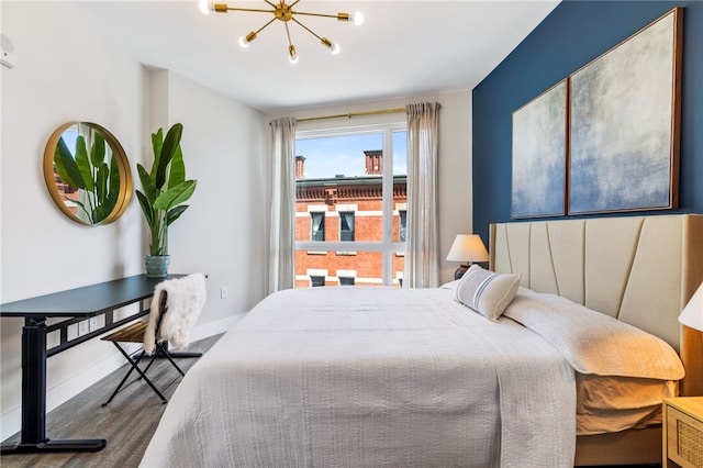 3725 Butler St Unit 406, Lawrenceville, PA 15201 - bedroom with wood finished floors, a chandelier, and baseboards