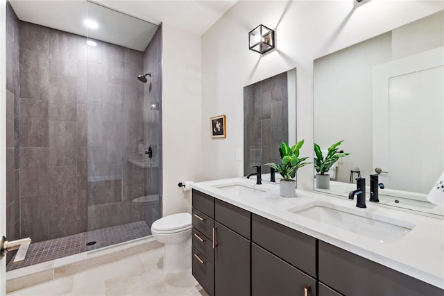 3725 Butler St Unit 406, Lawrenceville, PA 15201 - bathroom with toilet, double vanity, tiled shower, and tile patterned floors
