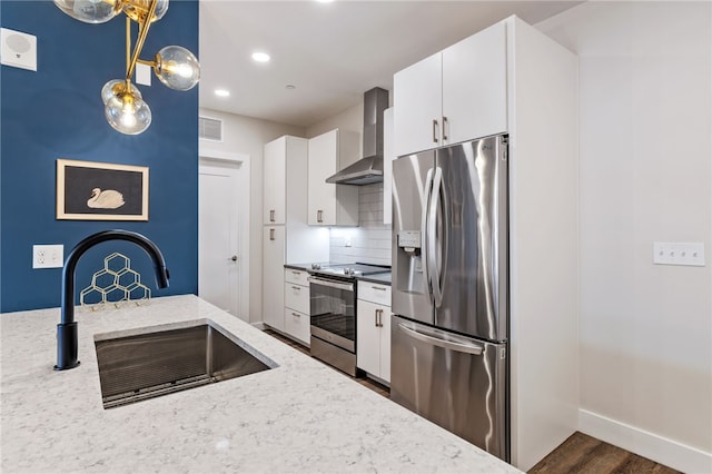 3725 Butler St Unit 406, Lawrenceville, PA 15201 - kitchen with stainless steel appliances, wall chimney exhaust hood, a sink, decorative backsplash, and dark wood-style flooring
