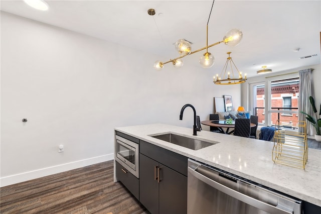 3725 Butler St Unit 406, Lawrenceville, PA 15201 - kitchen with appliances with stainless steel finishes, a sink, a chandelier, dark wood finished floors, and baseboards