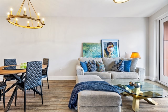 3725 Butler St Unit 406, Lawrenceville, PA 15201 - living area with a chandelier, wood finished floors, and baseboards