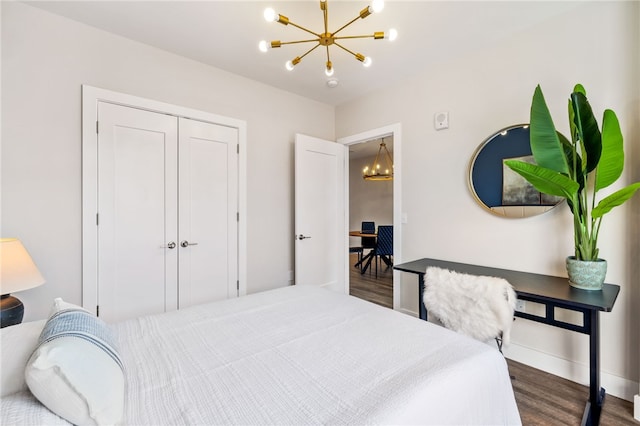 3725 Butler St Unit 406, Lawrenceville, PA 15201 - bedroom featuring a chandelier, wood finished floors, baseboards, and a closet