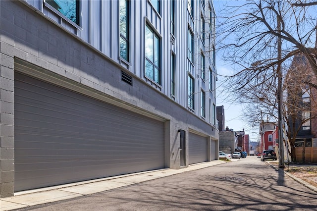 3725 Butler St Unit 406, Lawrenceville, PA 15201 - view of building exterior with a garage and driveway