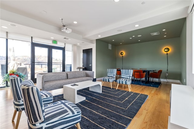 3725 Butler St Unit 406, Lawrenceville, PA 15201 - living area with wood finished floors, recessed lighting, french doors, and baseboards