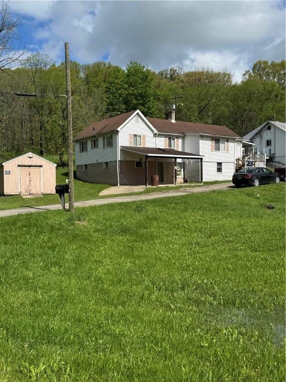 5 Navoski Ln, Smith, PA 15021 - view of front facade featuring a front yard, driveway, and a carport