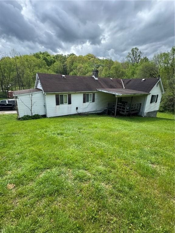5 Navoski Ln, Smith, PA 15021 - rear view of house featuring a lawn and a chimney