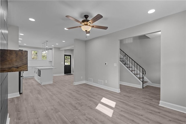 748 Anaheim St, Schenley Heights, PA 15219 - unfurnished living room featuring recessed lighting, light wood-style flooring, ceiling fan, stairway, and baseboards