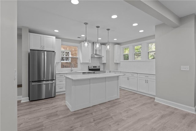 748 Anaheim St, Schenley Heights, PA 15219 - kitchen with stainless steel appliances, wall chimney range hood, white cabinetry, backsplash, and recessed lighting
