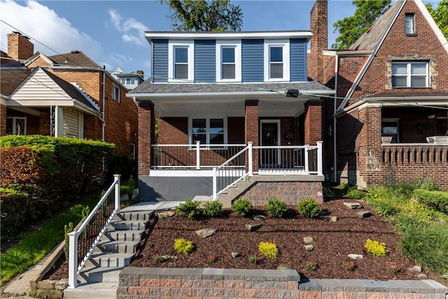 748 Anaheim St, Schenley Heights, PA 15219 - view of front of home featuring stairway, covered porch, and brick siding