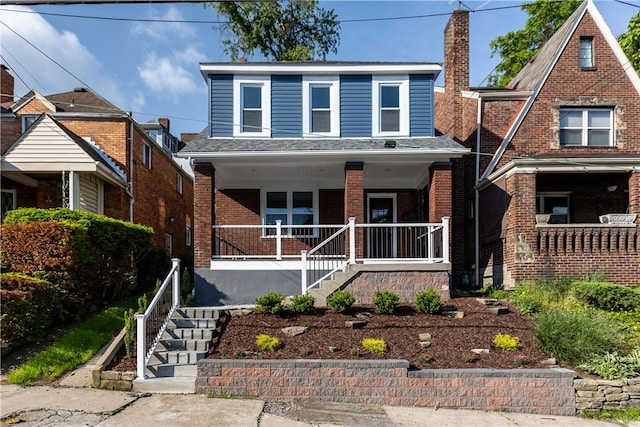 748 Anaheim St, Schenley Heights, PA 15219 - view of front of property with stairway, covered porch, and brick siding