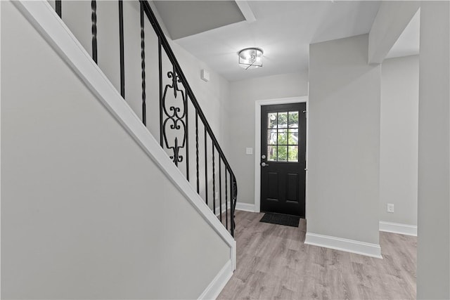 748 Anaheim St, Schenley Heights, PA 15219 - foyer featuring light wood finished floors, baseboards, and stairs