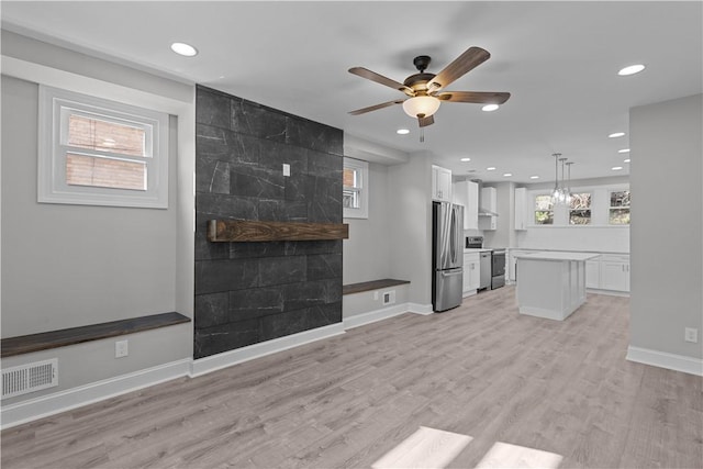 748 Anaheim St, Schenley Heights, PA 15219 - unfurnished living room with recessed lighting, a ceiling fan, plenty of natural light, and light wood finished floors