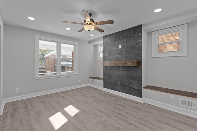 748 Anaheim St, Schenley Heights, PA 15219 - unfurnished living room featuring ceiling fan, recessed lighting, wood finished floors, a fireplace, and baseboards