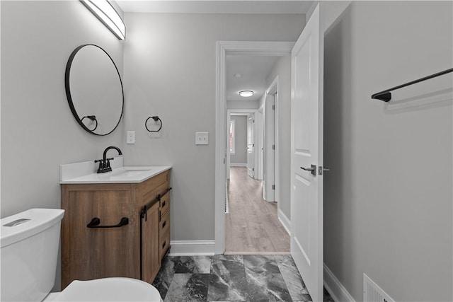 748 Anaheim St, Schenley Heights, PA 15219 - bathroom featuring toilet, vanity, marble look tile flooring, and baseboards