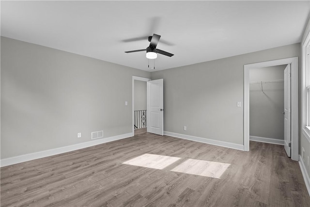 748 Anaheim St, Schenley Heights, PA 15219 - unfurnished bedroom featuring light wood-type flooring, baseboards, a spacious closet, a closet, and a ceiling fan