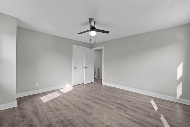 748 Anaheim St, Schenley Heights, PA 15219 - unfurnished bedroom featuring baseboards, wood finished floors, and a ceiling fan