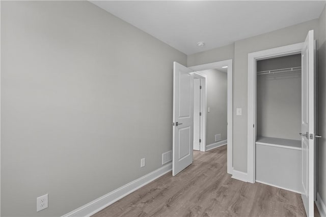748 Anaheim St, Schenley Heights, PA 15219 - unfurnished bedroom featuring baseboards, wood finished floors, and a closet