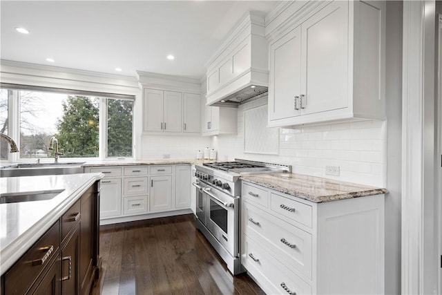 2293 Country Club Dr, Upper St Clair, PA 15241 - kitchen featuring double oven range, custom exhaust hood, a sink, white cabinets, and light stone counters