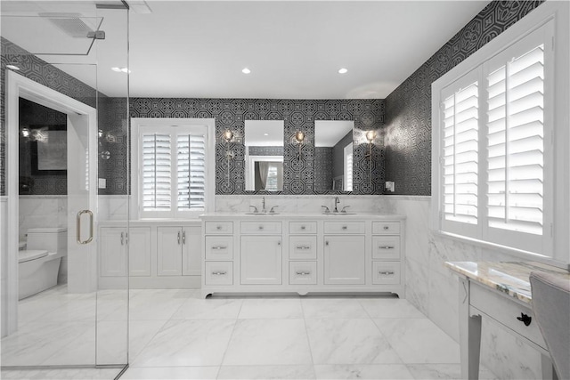 2293 Country Club Dr, Upper St Clair, PA 15241 - full bathroom featuring healthy amount of natural light, toilet, double vanity, tile walls, and wainscoting