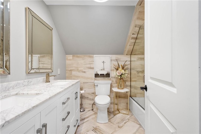 2293 Country Club Dr, Upper St Clair, PA 15241 - bathroom with double vanity, toilet, tile walls, shower / bathtub combination, and vaulted ceiling