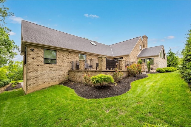 2293 Country Club Dr, Upper St Clair, PA 15241 - back of property featuring brick siding, a chimney, and a lawn
