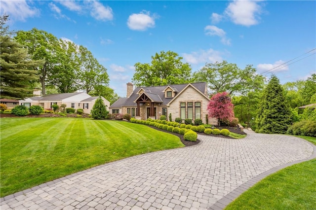 2293 Country Club Dr, Upper St Clair, PA 15241 - view of front of house with stone siding, a chimney, and a front yard