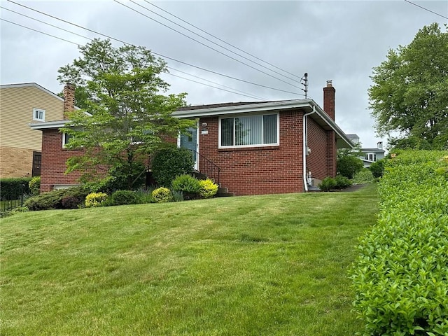 170 William Cir, Stowe Twp, PA 15136 - view of property exterior featuring a chimney, brick siding, and a yard