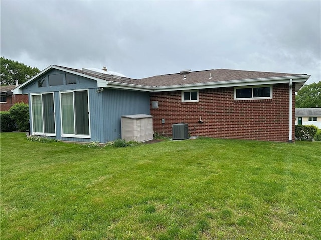 170 William Cir, Stowe Twp, PA 15136 - rear view of property with cooling unit, a yard, and brick siding