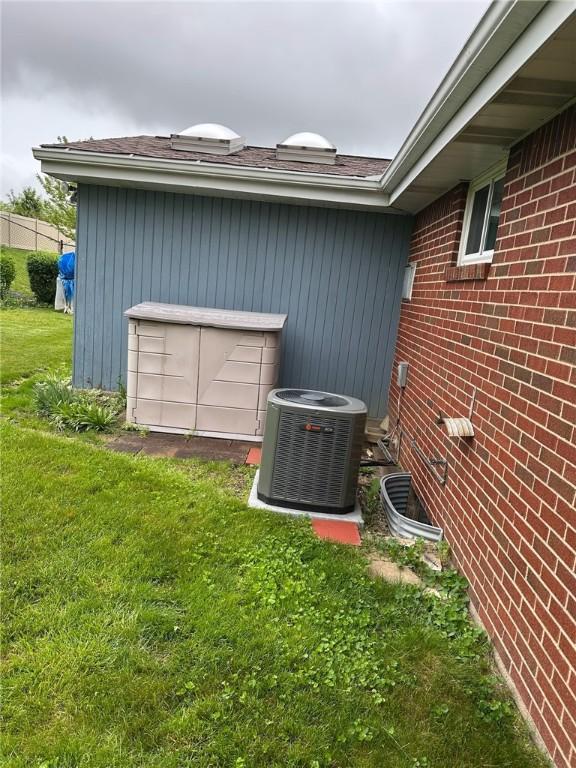 170 William Cir, Stowe Twp, PA 15136 - exterior view of cooling unit, brick siding, and gutters