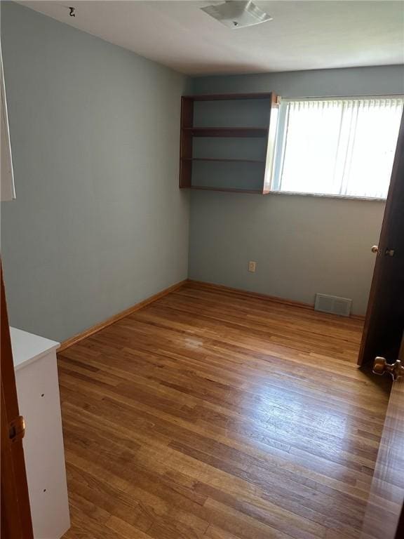 170 William Cir, Stowe Twp, PA 15136 - spare room with wood finished floors and baseboards