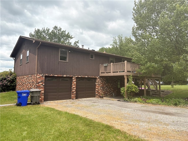 199 Lyon Ln, Lancaster Twp, PA 16037 - view of front of property with driveway, stairway, an attached garage, a deck, and brick siding